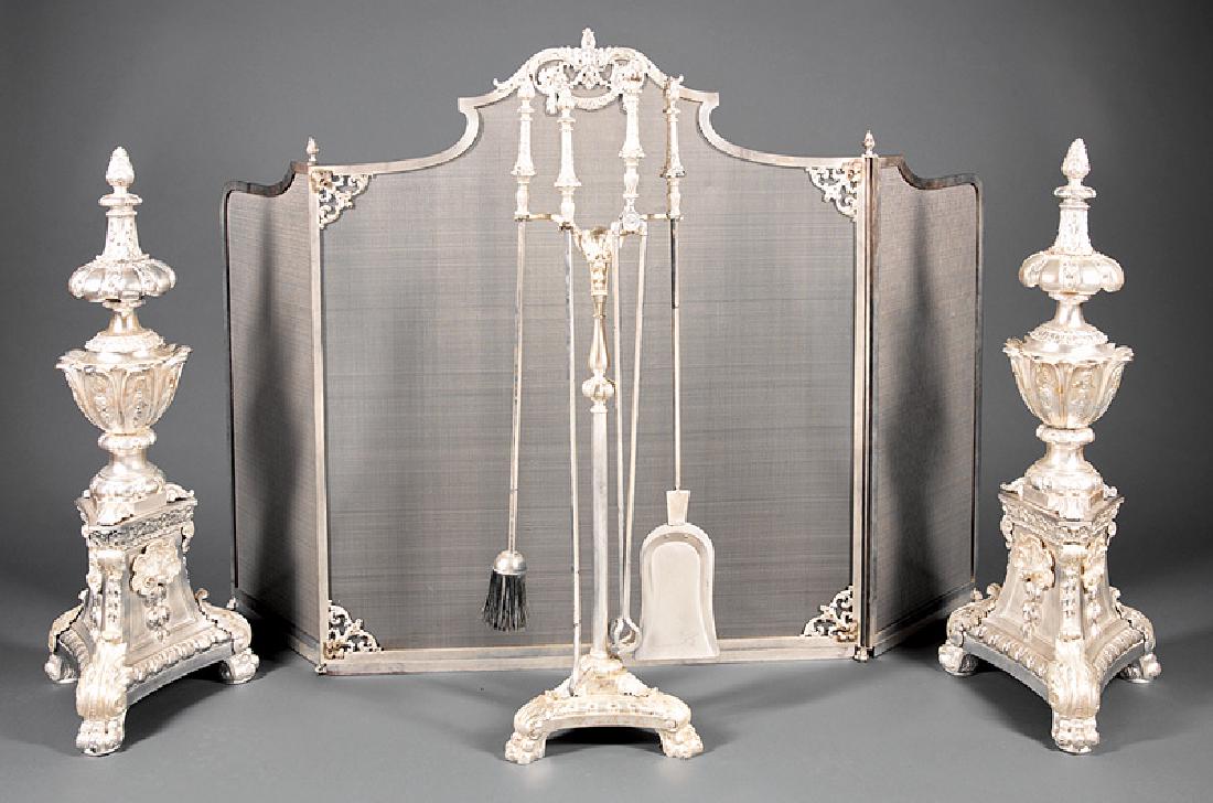Argente Bronze Fireplace Garniture: Neoclassical-Style Argente Bronze Fireplace Garniture, incl. pair of andirons, firescreen, 4 fire tools and stand, firescreen h. 38 in., w. (extended) 58 in. (7 pcs.) Provenance: Estate of Faith K. Ti