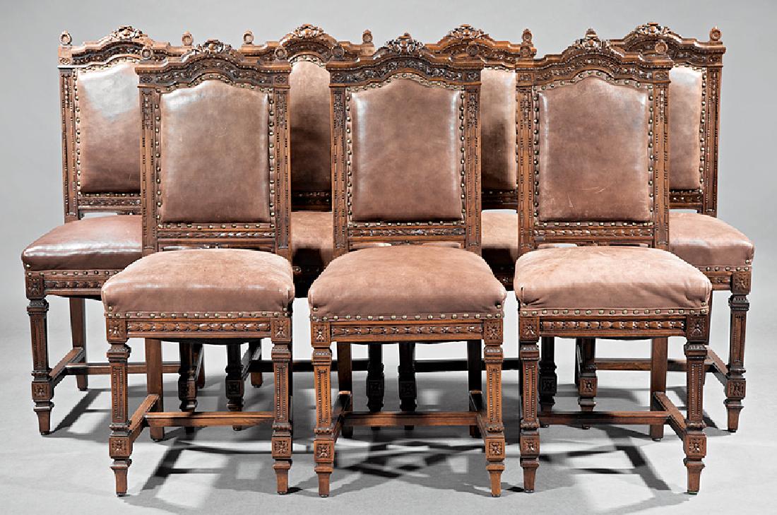American Belle Epoque Carved Walnut Side Chairs: Set of Seven American Belle Epoque Carved Walnut Side Chairs, late 19th c., arched bead and leaf crest rails, padded backs, conforming seats, rosette blocked legs, H stretchers, h. 42 1/2 in., w. 17 1