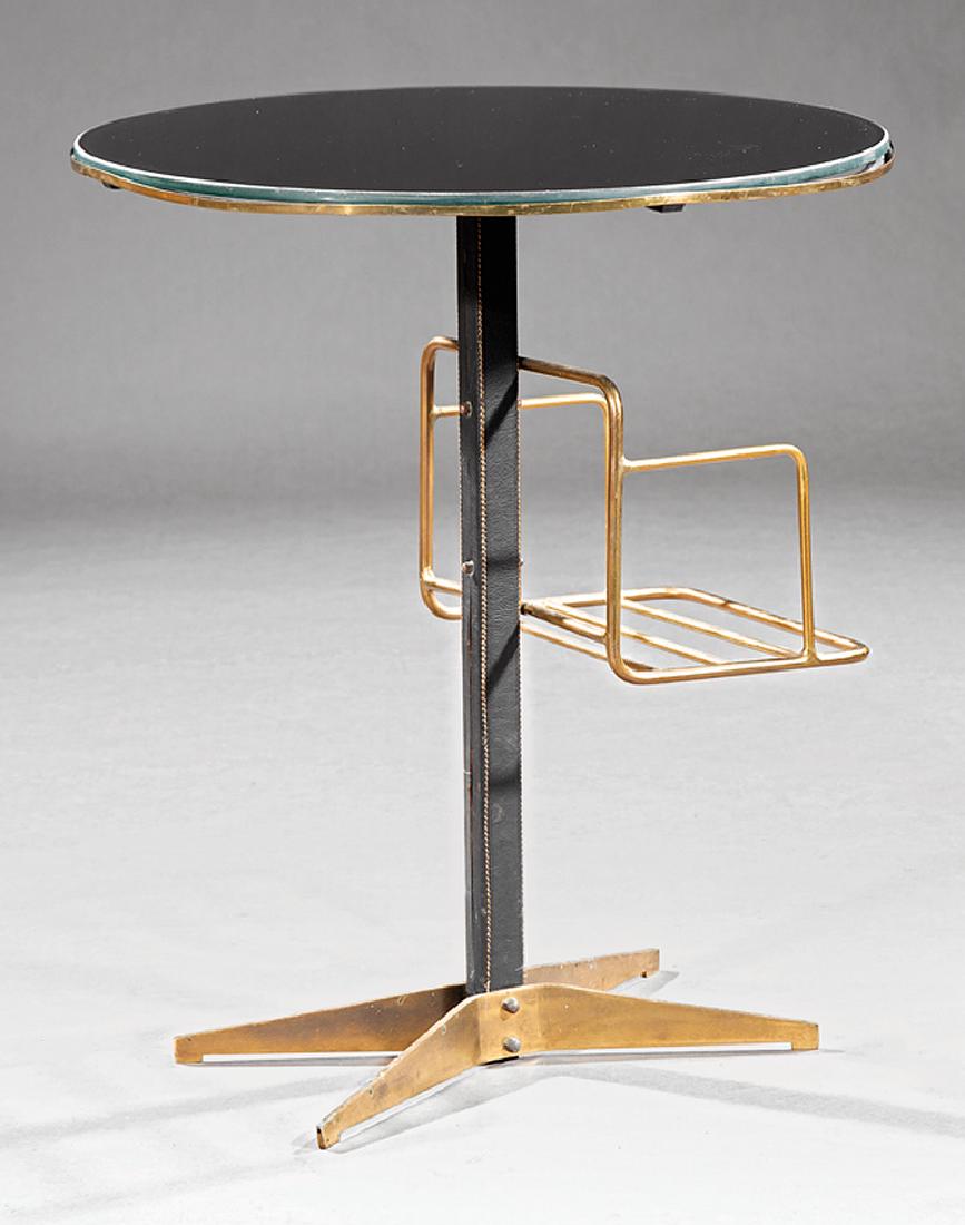 Stitched Leather & Brass Guéridon: Mathieu Mategot or Jacques Adnet Stitched Leather and Brass Guéridon, c. 1955, black glass top, leather covered support, brass bookshelf, x-form brass legs, h. 27 in., w. 23 in., d. 23 in.