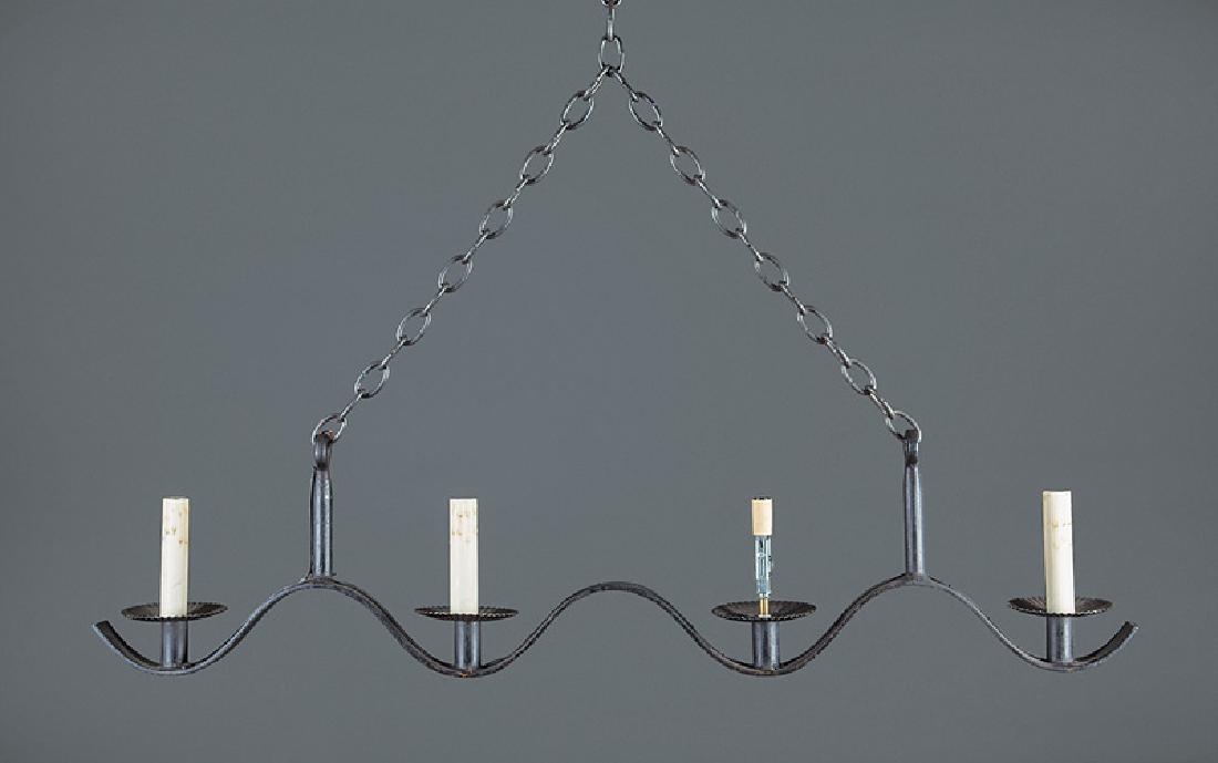 Jean Royère Painted Iron Four-Light Chandeliers: Pair of Jean Royère Painted Iron Four-Light Chandeliers, c. 1945, serpentine form, fluted drip pans, electrified, h. (incl. chain) 55 in., w. 43 in., d. 4 1/4 in. Provenance: Sotheby's, London, Apr. 
