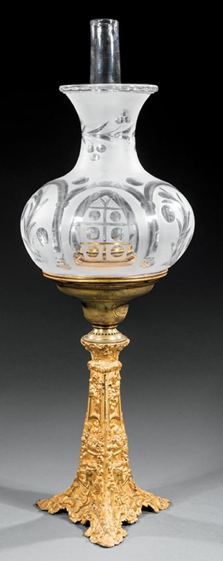 American Gilt Bronze Solar Lamp, marked Cornelius: American Gilt Bronze Solar Lamp, c. 1850, marked Cornelius, Philadelphia, tapered triangular base with flowers and foliage, frosted shade cut with gothic arch windows, h. 23 in., dia. 8 1/4 in. Proven