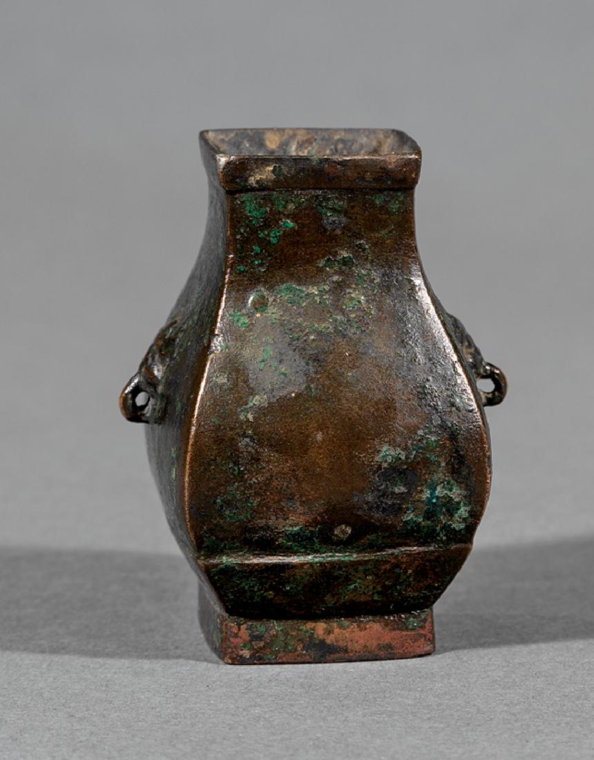 Chinese Bronze Miniature Hu Vase: Chinese Bronze Miniature Hu Vase, Ming Dynasty (1368-1644), faceted body with mask-ring handles, h. 2 3/4 in. Provenance: James D. Julia, Feb. 3-5, 2016, lot 3007; New Orleans Antiquarian