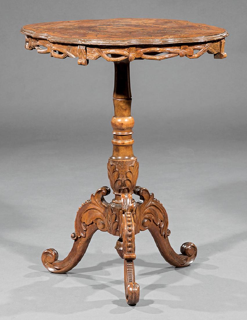 Swiss Black Forest Inlaid Tilt-Top Table: Small Swiss Black Forest Inlaid Tilt-Top Table, 19th c., serpentine branchwork carved top, turned foliate standard, arched beaded legs, scrolled toes, h. 29 in., w. 25 in., d. 17 3/4 in