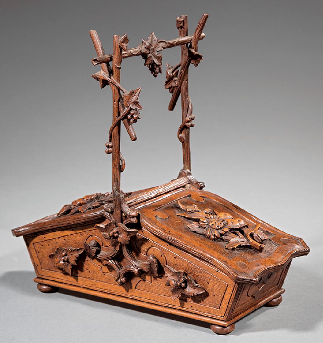 Black Forest Carved Walnut Basket-Form Box: Antique Black Forest Carved Walnut Basket-Form Box, carved with grapevines and flowers, h. 10 1/2 in., w. 11 in., d. 5 1/2 in