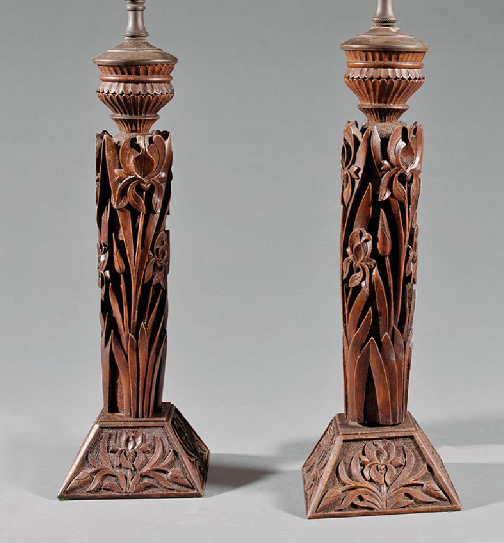Pair of Black Forest Carved Walnut Lamps: Pair of Black Forest Carved Walnut Lamps, early 20th c., foliate design, pyramidal base, h. to socket 19 in