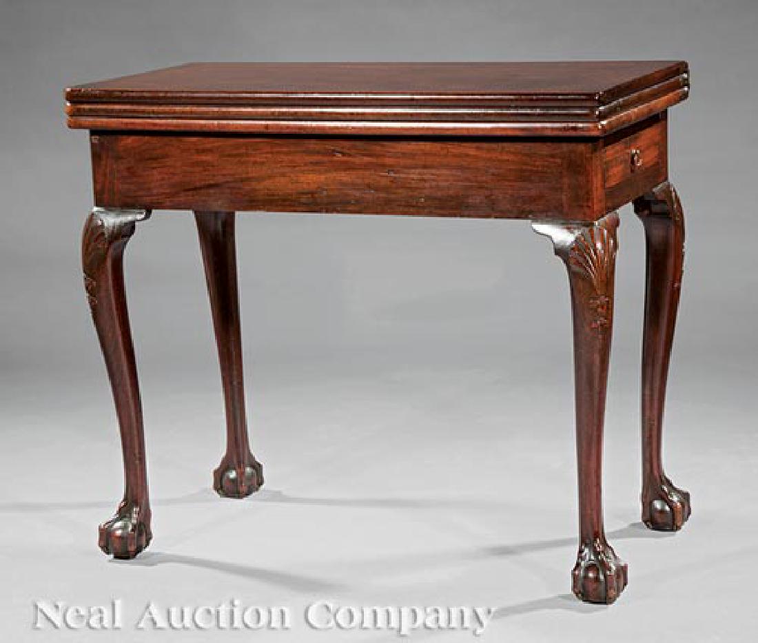 George II Carved Mahogany Triple Top Games Table: George II Carved Mahogany Triple Top Games Table, c. 1750, foldover top opening to polished surface, then to later baize-lined playing surface with wells for gaming pieces, frieze drawer, cabriole leg