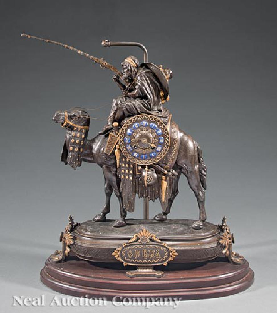 French Gilt, Patinated Metal Figural Mantle Clock: Antique French Gilt and Patinated Metal Figural Mantel Clock, c. 1880, movement marked "Gardien a Chern/ Paris", figure of an Arabian warrior on camelback, oval base, scrolled base, front cartouche wi