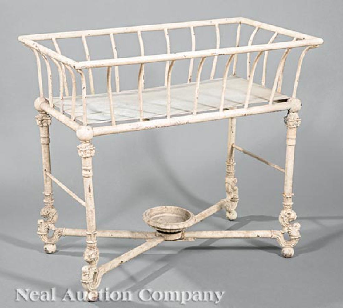 English Painted Cast Iron Planter: Antique English Painted Cast Iron Planter, flared basket on columnar supports, X stretcher surmounted by an urn, h. 27 in., w. 29 3/4 in., d. 17 1/2 in