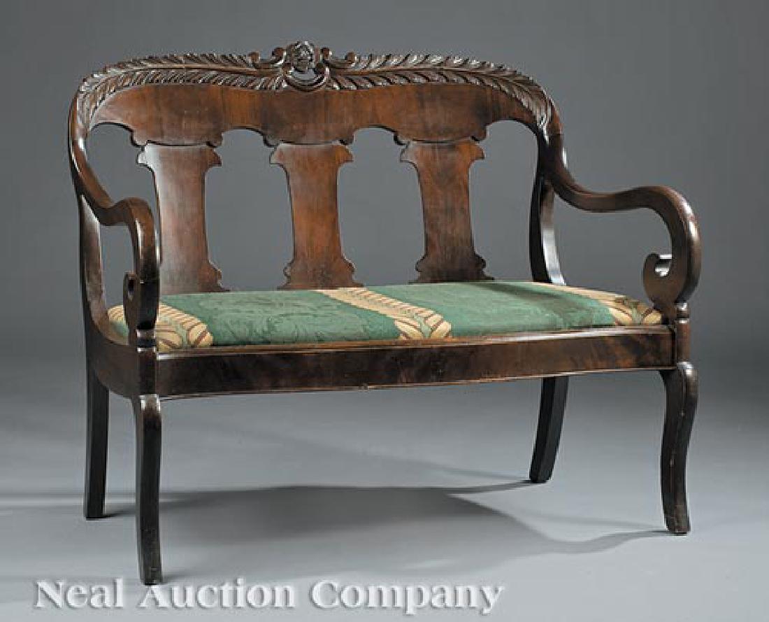 American Carved Mahogany Settee: American Carved Mahogany Settee in the Classical Taste, late 19th c., acanthus-carved crest rail, scrolled arms, serpentine molded seat rail, saber legs, h. 36 in., w. 44 in., d. 21 1/2 in
