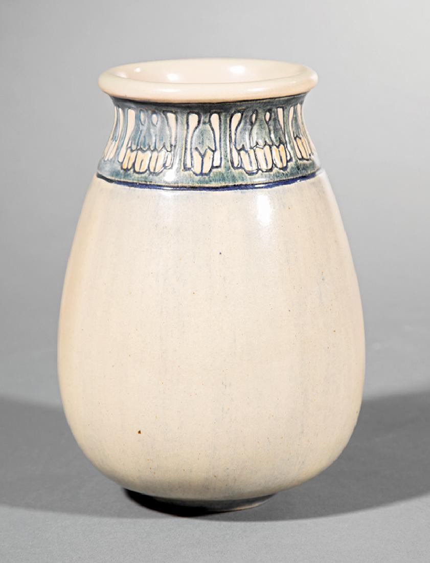 Newcomb College Art Pottery High Glaze Vase: Newcomb College Art Pottery High Glaze Vase, 1905, decorated by Marie De Hoa LeBlanc with relief-carved band of sweet laurel blossoms, blue, green and white underglaze, base marked with Newcomb cipher