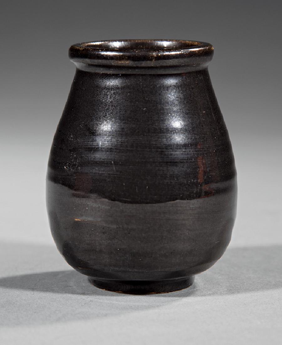 Newcomb College Art Pottery Forty Thieves Jar: Newcomb College Art Pottery Forty Thieves "Ali Baba" Jar, c. 1920, glossy black glaze, base marked with Newcomb cipher, h. 3 1/8 in