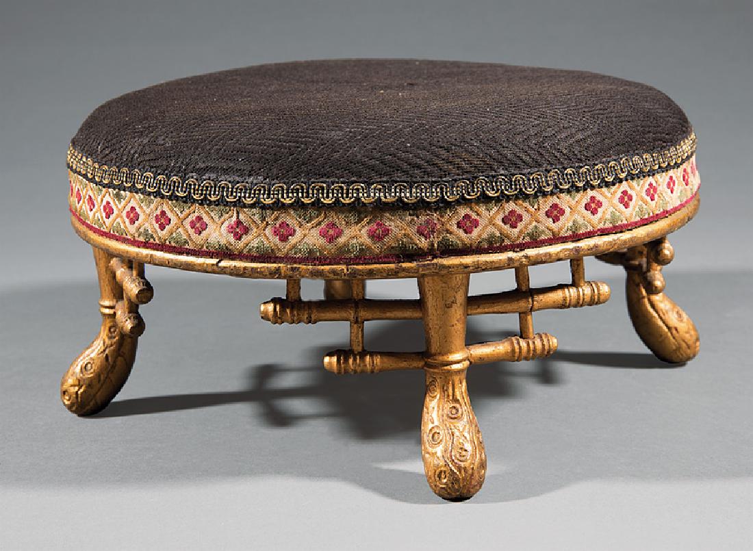 American Aesthetic Carved Giltwood Footstool: American Aesthetic Carved Giltwood Footstool, late 19th c., shaped legs with faux bamboo brackets, h. 7 in., dia. 14 1/2 in