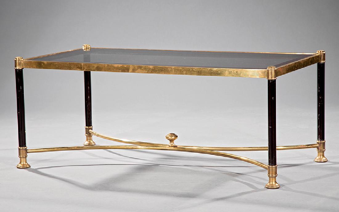 Vintage Continental Brass and Glass Coffee Table: Vintage Continental Brass and Glass Coffee Table, 20th c., inset top, shaped stretchers surmounted by a bullseye finial, turned feet, h. 17 1/2 in., w. 43 in., d. 21 1/2 in. Provenance: The Gables Ant