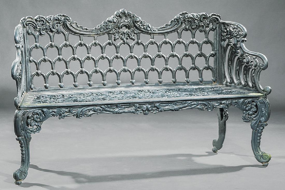 American Cast Iron Garden Bench: American Cast Iron Garden Bench, scrolling crest, reticulated back and seat, cabriole legs, h. 35 1/2 in., w. 59 in., d. 16 in. Note: The design for this bench was patented in England in 1846 by the C