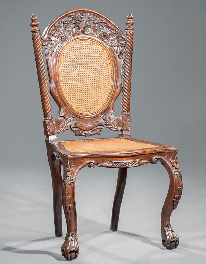 English Carved Walnut Side Chair: English Carved Walnut Side Chair, late 19th c., reticulated crest, spiral-turned stiles surmounted by finials, caned back and seat, cabriole legs, ball and claw feet, h. 44 1/2 in., w. 23 1/2 in., d.