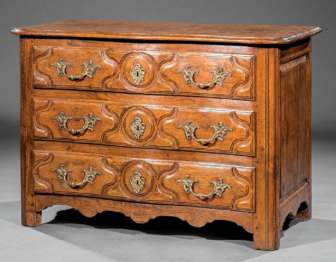 French Provincial Carved Walnut Commode: French Provincial Carved Walnut Commode, 18th c., molded serpentine top, three raised panel drawers, shaped base, block feet, h. 33 in., w. 49 in., d. 25 in