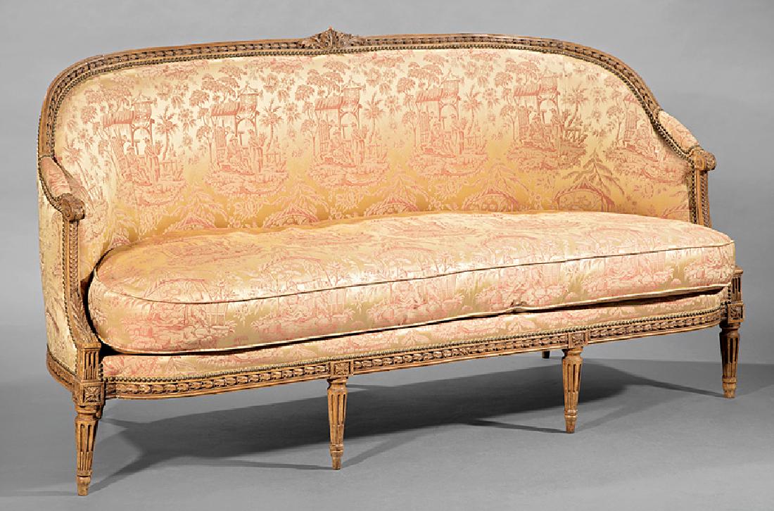 Louis XVI Carved Beechwood Canapé: Louis XVI Carved Beechwood Canapé, late 18th c., stamped "St. Georges Paris", foliate crest rail centered by an acanthus medallion, scrolled and padded arms, conforming blocked seat rail, stop-fluted