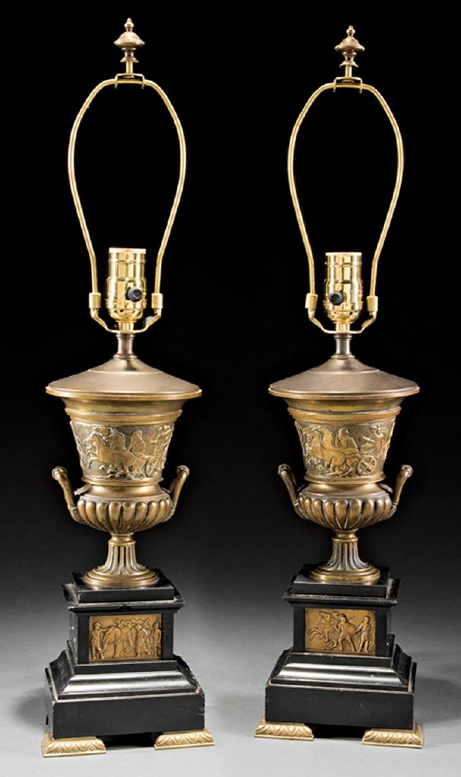 Pair of French Empire-Style Bronze Campagna Urns: Pair of French Empire-Style Bronze Campagna Urns, Roman chariot frieze, on black onyx bases, now mounted as lamps, h. (with shades) 23 1/2 in. Provenance: Williamson-LeBlanc Collection, Cornstalk Fenc