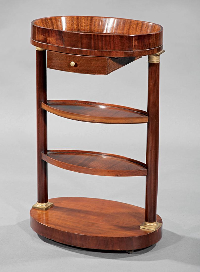 Empire Bronze-Mounted Mahogany Elliptical Work Table: Empire Bronze-Mounted Mahogany Elliptical Work Table, early 19th c., tray top, four tiers with columnar supports, plinth base, h. 30 in., w. 19 in., d. 13 in. Provenance: Williamson-LeBlanc Collection