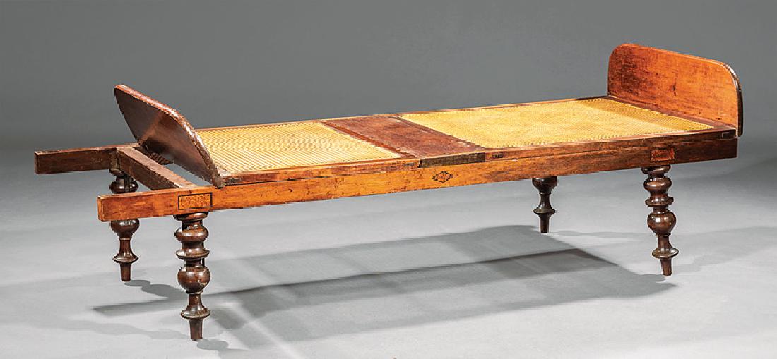 William IV Mahogany Campaign Bed: William IV Mahogany Campaign Bed, early 19th c., two folding caned sections with foot boards, resting on a frame with carrying handles, turned legs, h. 23 1/4 in., l. 73 1/2 in., w. 26 1/4 in