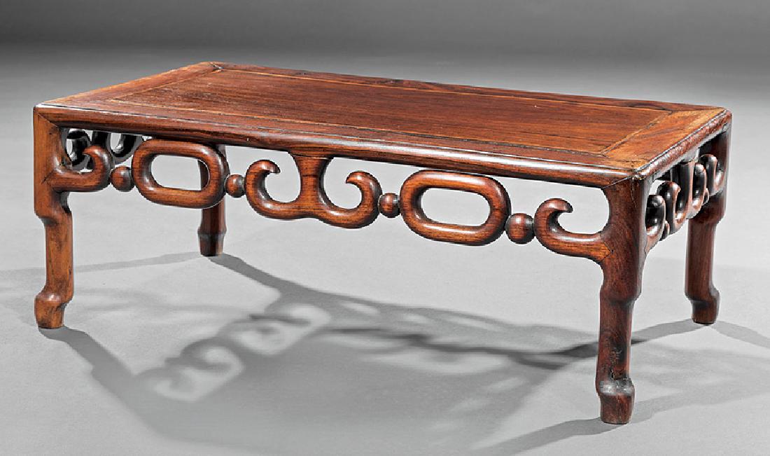 Chinese Hardwood Low Table/Kang: Chinese Hardwood Low Table/Kang, inset rectangular plank top, reticulated apron carved with scrolls, beads and rings, shaped legs, h. 11 in., w. 30 in., d. 16 1/4 in
