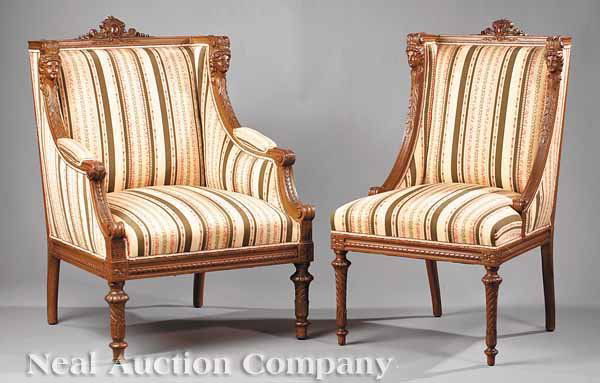Two Empire-Style Carved Gilded, Painted Chaises: Two Empire-Style Carved Gilded and Painted Chaises , late 19th c., armchair with foliate cabochon crest, acanthus arms topped by classical busts, straight seat rail on turned legs, with a conforming s