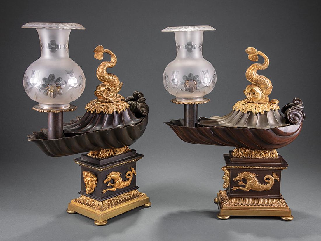 Regency Gilt and Patinated Bronze Argand Lamps: Fine Near Pair of Regency Gilt and Patinated Bronze Argand Lamps, c. 1840, each with shell font, with dolphin finial, tall plinth base with mask and hippocampus, floral cut shades, h. 17 1/2 in., w. 1