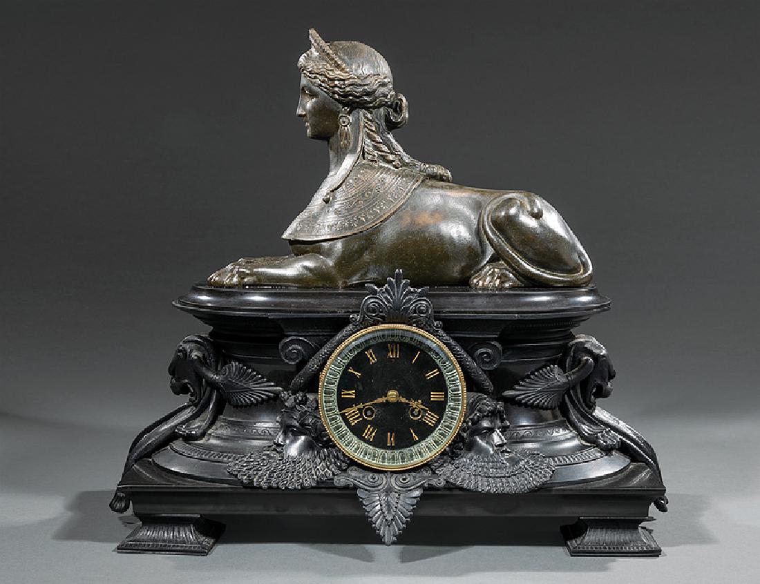 Patinated Metal, Marble Mantel Clock: Egyptian Revival Patinated Metal and Marble Mantel Clock, mid-19th c., French movement, case surmounted by a sphinx, mounted with masks and panther pelts, h. 16 3/4 in., w. 18 3/4 in., d. 9 in. Proven