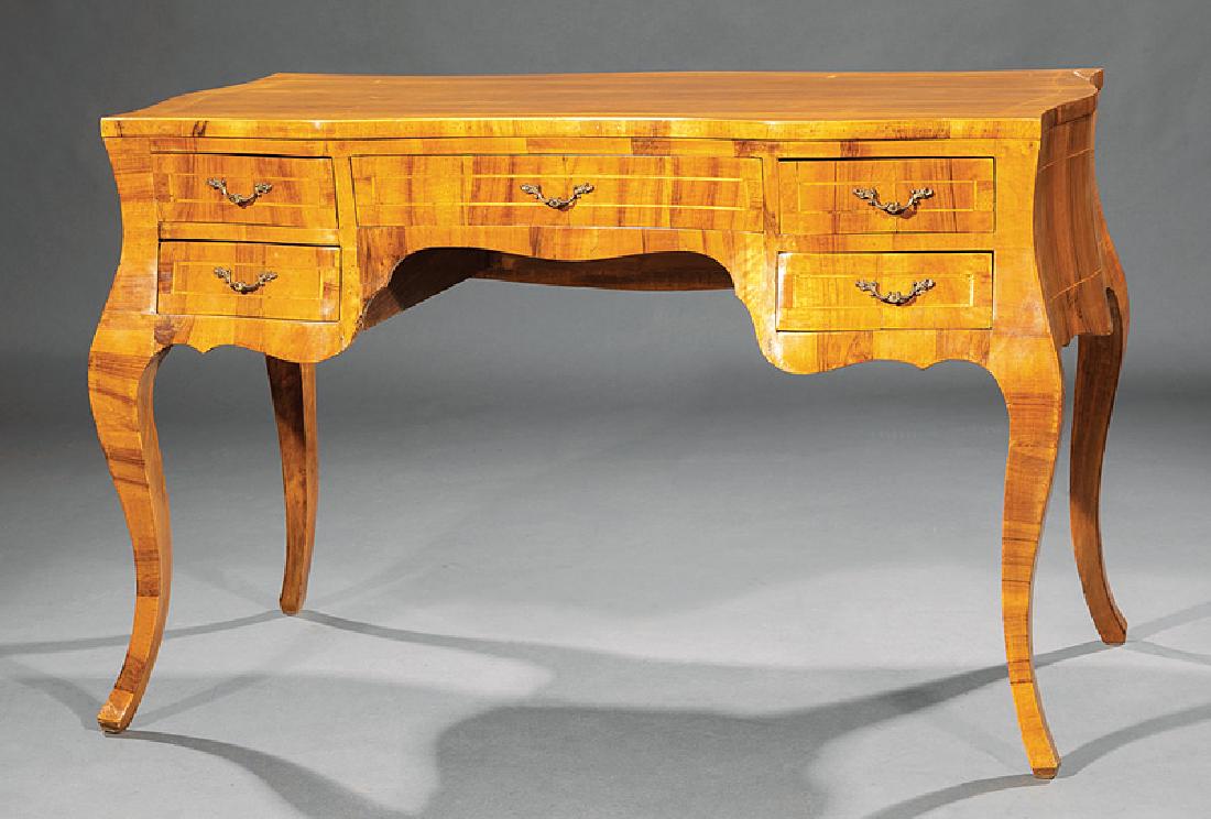 Continental Rococo-Style Fruitwood Writing Desk: Continental Rococo-Style Fruitwood Writing Desk, probably Italian, serpentine top, kneehole configuration of drawers, flared cabriole legs, h. 31 1/2 in., w. 48 1/2 in., d. 25 in