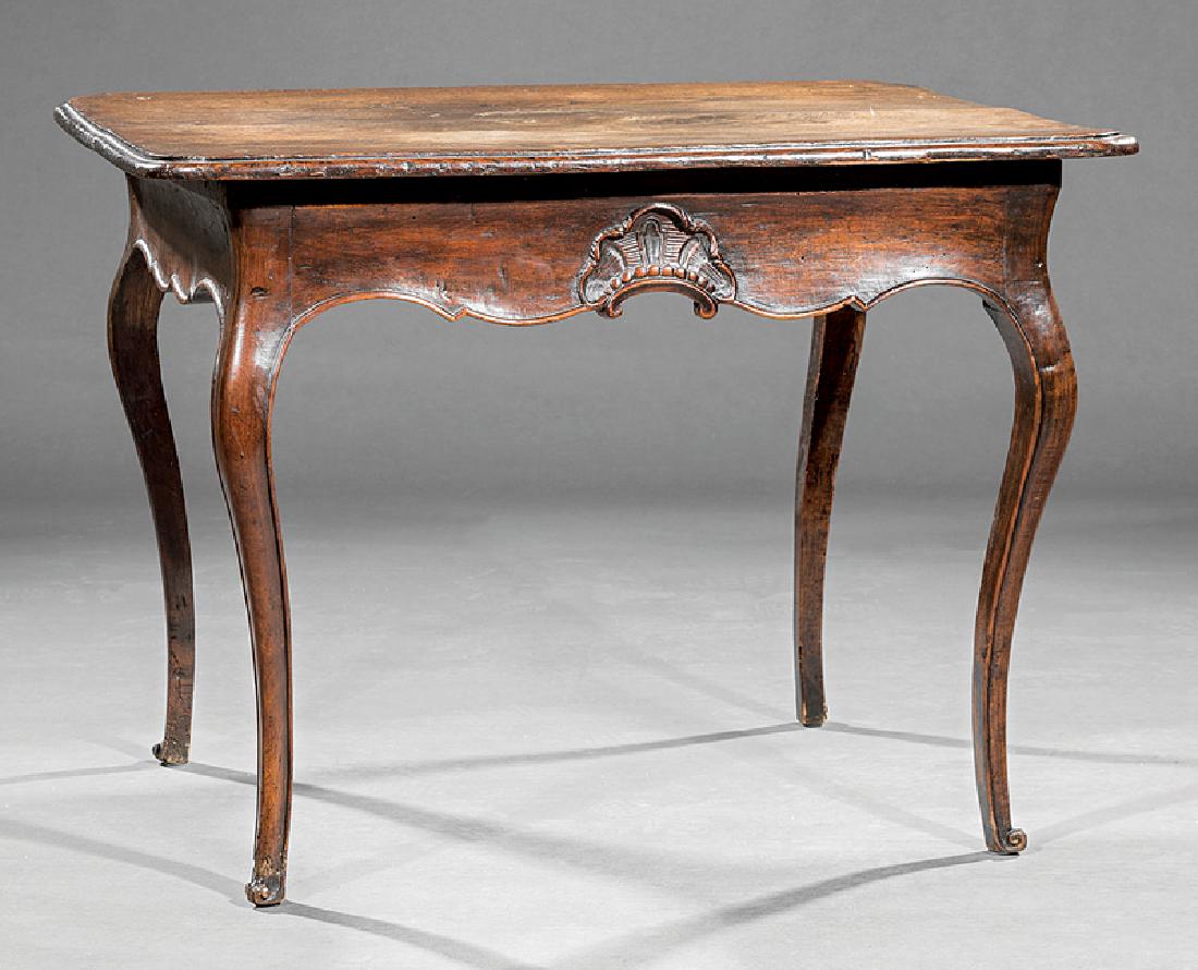 French Provincial Carved Walnut Side Table: French Provincial Carved Walnut Side Table, late 18th/early 19th c., molded top, shaped apron fitted with a drawer, cabriole legs, scrolled toes, h. 28 in., w. 38 1/4 in., d. 28 3/4 in