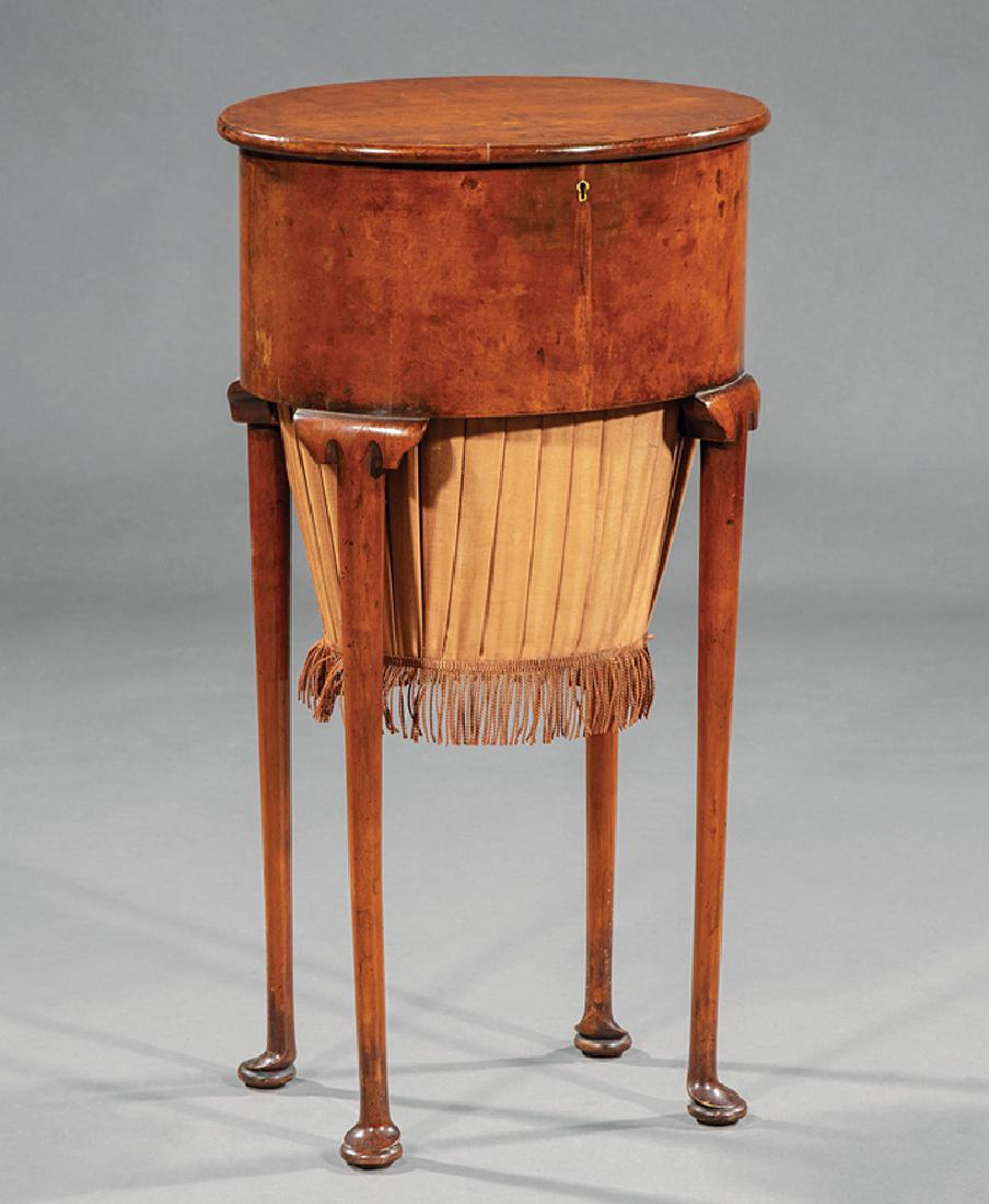 English Walnut Sewing Table: English Walnut Sewing Table, oval lift top, fitted removable tray and silk pleated work compartment, h. 28 1/2 in., w. 15 1/2 in., d. 12 in