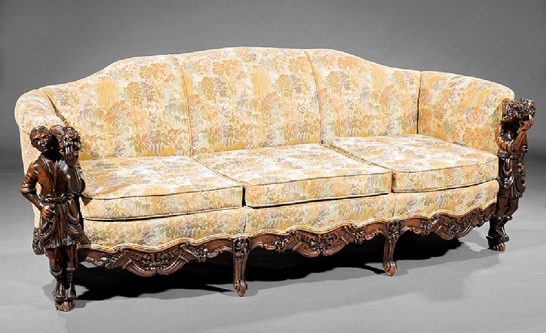 Continental Carved Walnut Parlor Suite: Antique Continental Carved Walnut Parlor Suite, incl. sofa and armchair, figural uprights of Brustalon inspiration, cabriole legs, sofa h. 33 1/2 in., w. 86 in., d. 34 in.; chair h. 33 1/2 in., w. 41 