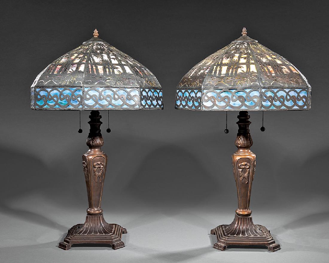 Pair of Bronzed Metal and Slag Glass Lamps: Pair of Bronzed Metal and Slag Glass Lamps, 20th c., vasiform standard, leaded slag glass shade, with palm tree overlay, h. 28 in., dia. 17 1/2 in