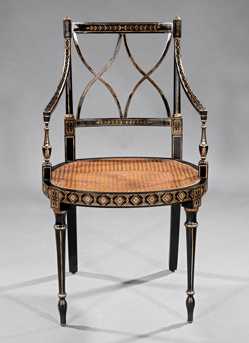 Ebonized and Gilt Decorated Armchair: Regency-Style Ebonized and Gilt Decorated Armchair, Neoclassical decoration, caned seat, turned tapered legs. Provenance: Williamson-LeBlanc Collection, Cornstalk Fence House, New Orleans