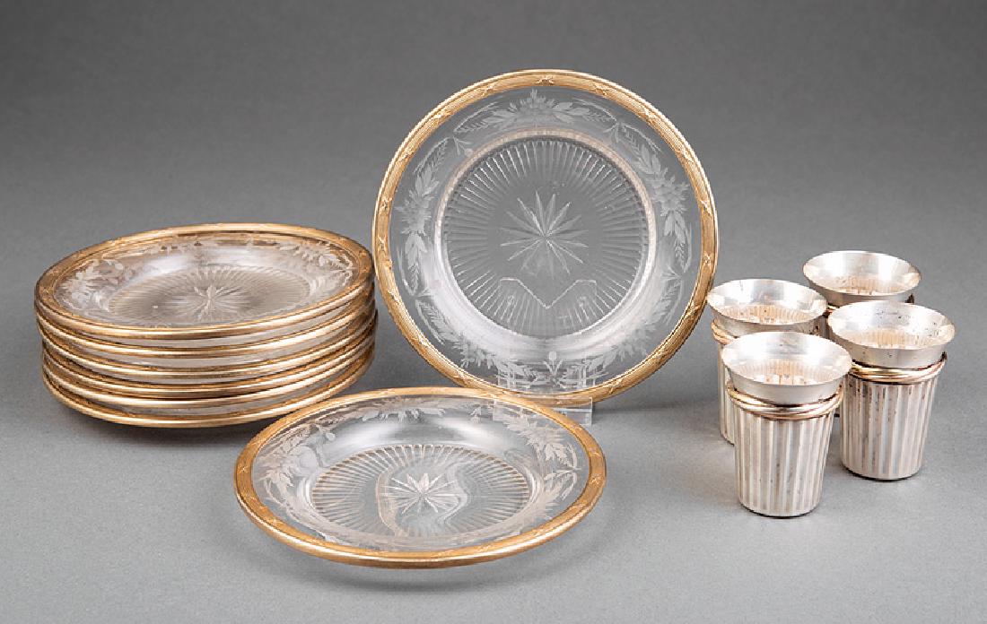Cartier Sterling Silver, Tri-Color Gold Cordials: Four Cartier Sterling Silver and Tri-Color Gold Cordials, h. 2 1/2 in., combined wt. 3.55 troy ozs; together with 8 cut and etched glass coasters with gild bound reed borders, dia. 5 5/8 in. Provenanc
