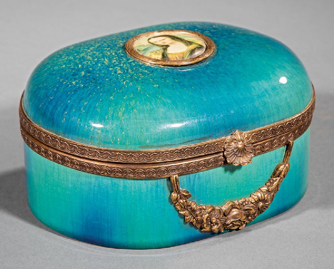Bronze-Mounted Faience Dresser Box: Bronze-Mounted Faience Dresser Box, c. 1929, Sevres MNF France mark, hinged cover mounted with a portrait of da Vinci's "La Gioconda", bronze rims, clasp and floral swag, mottled green speckled blue g