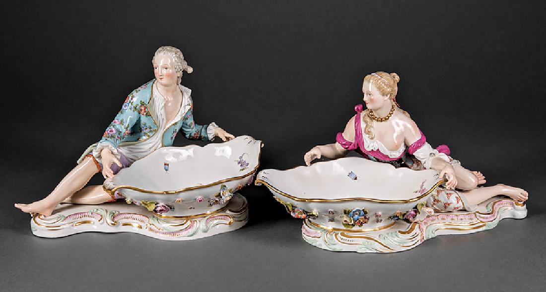 Meissen Polychrome, Porcelain Sweetmeat Dishes: Pair of Meissen Polychrome and Gilt Porcelain Figural Sweetmeat Dishes, 19th c., crossed swords marks, impressed "147", and incised "2858" or "2863", reclining male and female with floral applied bowl