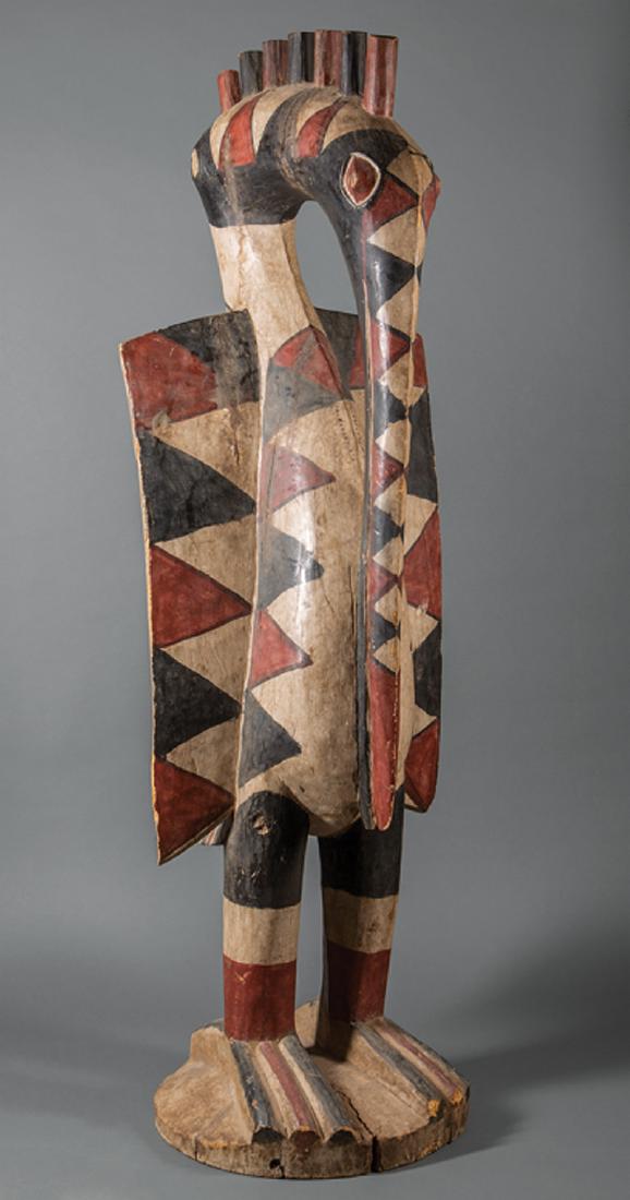 African Senufu or Senufu-Style Wood Hornbill: Monumental African Senufu or Senufu-Style Carved and Painted Wood Figure of a Hornbill, h. 71 in., w. 23 in., d. 23 in. Provenance: Memphis Brooks Museum of Art, Memphis, TN. Condition: Surface marks,