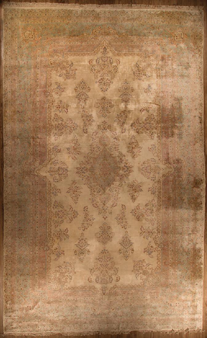 Large Persian Laver Kirman Rug: Large Persian Laver Kirman Rug, 20th c., Iran, muted cream, red and blue, 16 ft. 7 in. x 26 ft. 4 in. Provenance: Property of the Mobile Museum of Art, Mobile, AL; Sold to Benefit their Collections, C