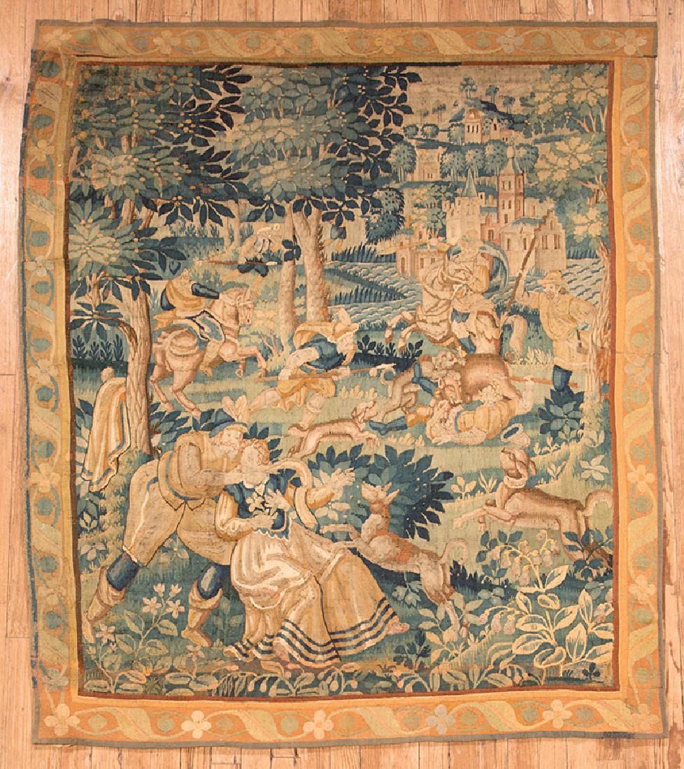 Antique Continental Verdure Tapestry: Antique Continental Verdure Tapestry, depicting figures in a verdant landscape engaged in a hunt, 6 ft. 3 in. x 7 ft. 5 in. Provenance: Property of the Mobile Museum of Art, Mobile, AL; Sold to Benefi