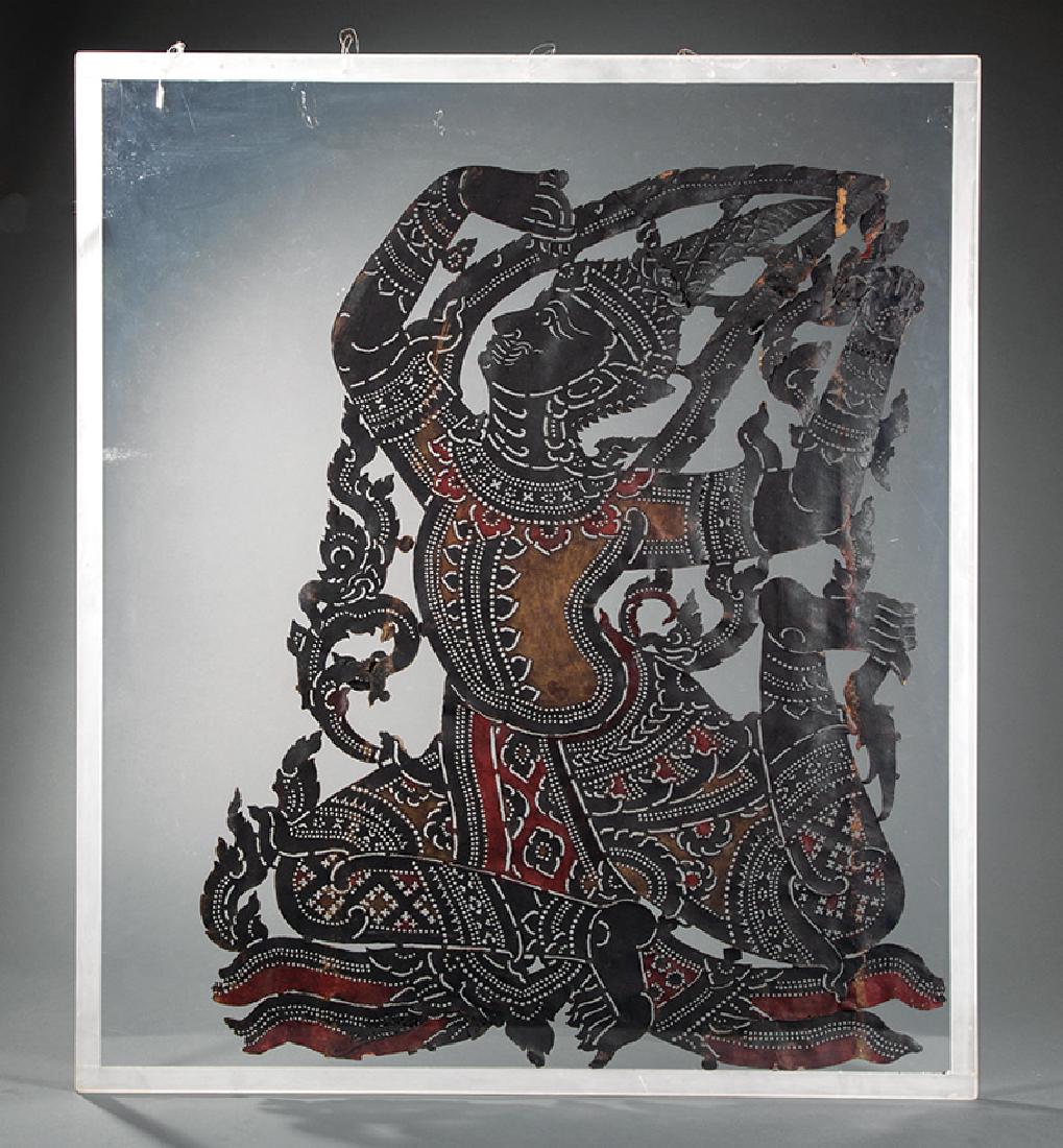 Thai Leather Hide Shadow Puppet Figure: Thai Cut and Painted Leather Hide Shadow Puppet Figure, Nang Yai, probably late 19th/early 20th c., h. 39 3/4 in., w. 33 in., presented between two acrylic panels and framed, overall 45 7/8 in. x 39 3