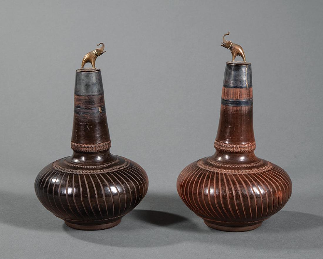 Indian or Southeast Asian Pottery Bottle Flasks: Pair of Antique Indian or Southeast Asian Brass and Silver Mounted Pottery Bottle Flasks, Surahi, elephant stoppers, h. 8 1/8 in. Provenance: Property of the Mobile Museum of Art, Mobile, AL, acquired