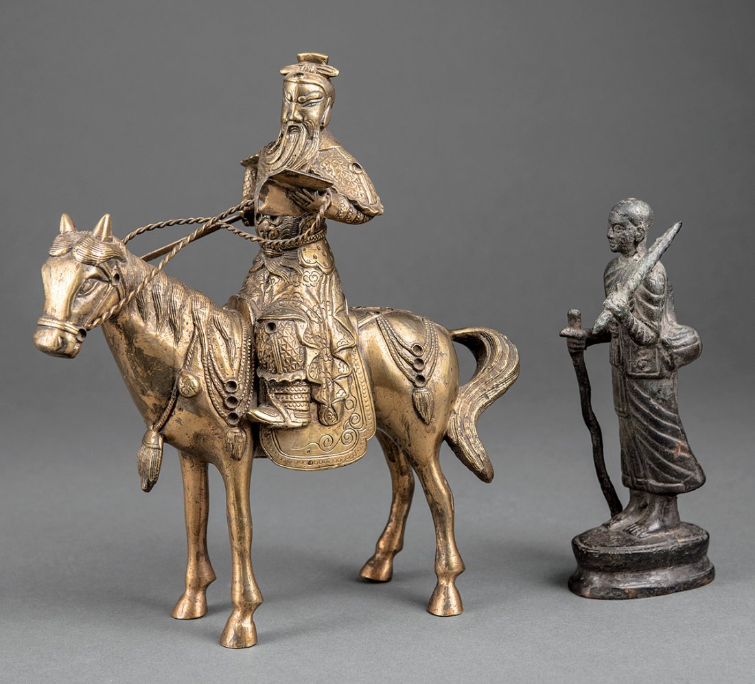 Chinese Gilt Metal Figure of Guandi/Guanyu: Chinese Gilt Metal Figure of Guandi/Guanyu, probably early 20th c., modeled seated on a horse bearing a sword and reading the Spring and Autumn Annals, wearing armor emblazoned with a tiger on the che
