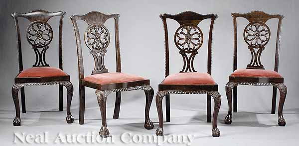 Set of Four Antique Chippendale-Style Chairs: A Set of Four Antique Chippendale-Style Carved Mahogany Dining Chairs , serpentine crest rails with wheel splats, trapezoidal slip seats, cabriole legs with ball and claw feet , height 40 in * NO RETU