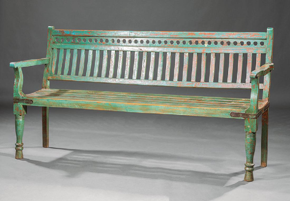 English Railway Station Bench: English Railway Station Bench, early 20th c., slatted back and seat, shaped arms, bulbous-turned legs, turned feet, weathered green paint, h. 38 1/2 in., w. 73 1/2 in., d. 18 1/2 in. Provenance: Fires