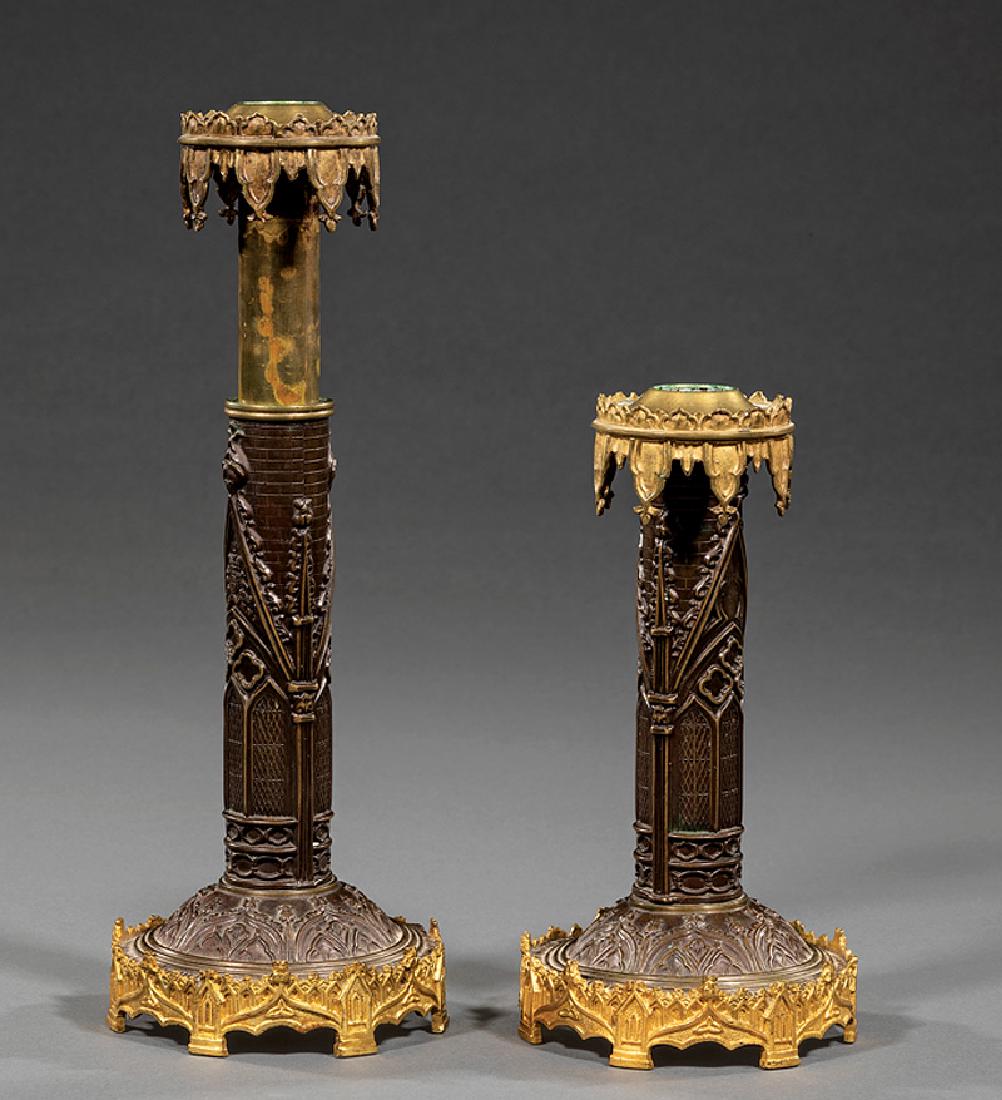 English Patinated Bronze Adjustable Candlesticks: Pair of English Gothic Patinated Bronze Adjustable Candlesticks, 19th c., cast with arch and window designs, h. 7 in. to 10 1/2 in
