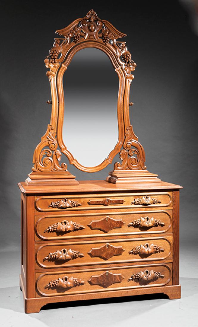 American Rococo Carved Walnut Bedroom Suite: American Rococo Carved Walnut Bedroom Suite, incl. bedstead, dresser and dressing table, dresser with carved mirror support, arched cabochon carved crest, shaped mirror, glove boxes, four grape carved