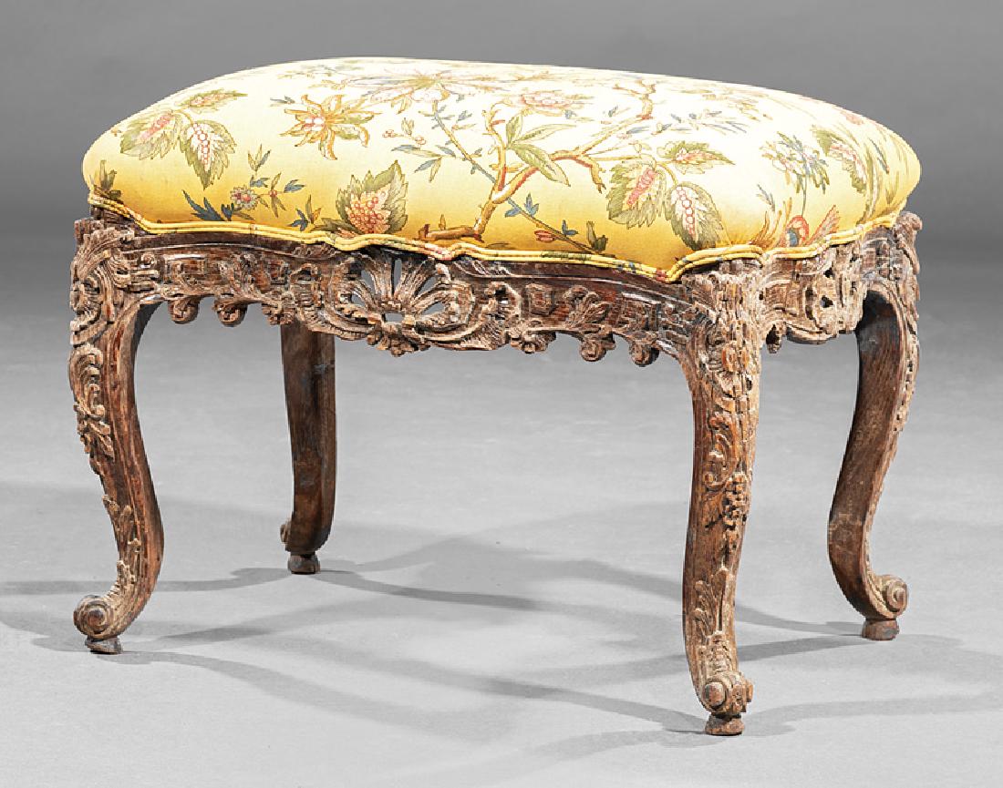 Continental Rococo Carved Walnut Footstool: Continental Rococo Carved Walnut Footstool , h. 14 in., w. 19 1/2 in., d. 13 5/8 in