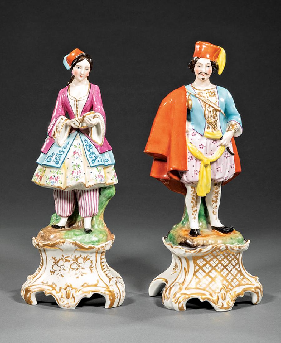 Pair of Paris Porcelain Figures: Pair of Paris Porcelain Figures, 19th c., in the style of Jacob Petit, unmarked, depicting colorfully dressed couple on scrolled bases with gilt highlights, male h. 14 in., female h. 13 1/2 in. Proven