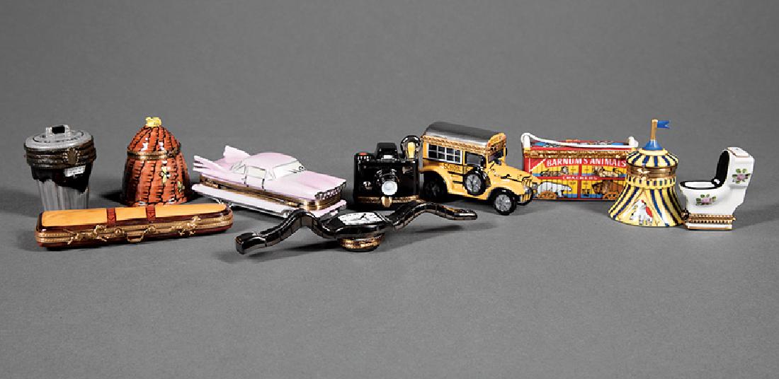 Group of Ten Limoges Porcelain Boxes: Group of Ten Limoges Porcelain Boxes, marked, incl. wristwatch; pink Cadillac; school bus; beehive; old-fashioned camera; double-hinged New York City 42nd Street garbage can with trash; toilet; circus